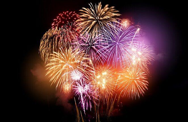 Bright and colourful fireworks display celebrations at night.